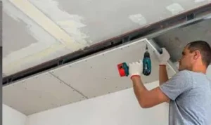 Installing ceiling in London office